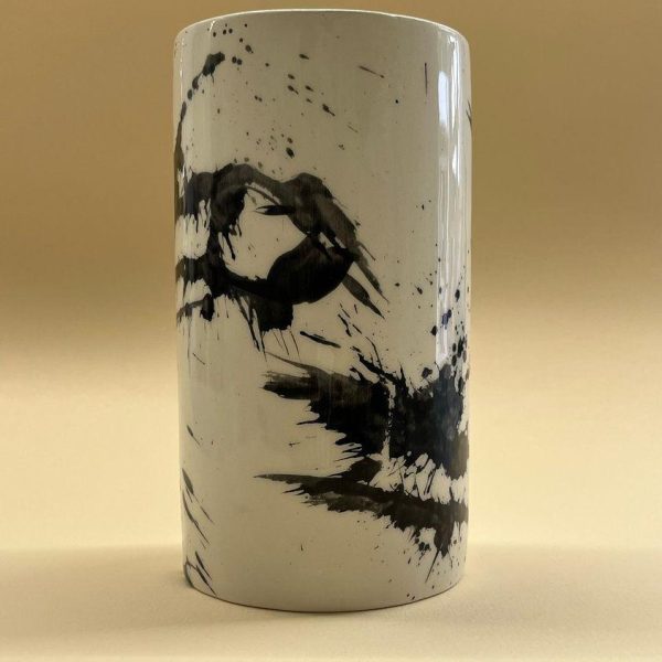 large black and white cylindrical vase